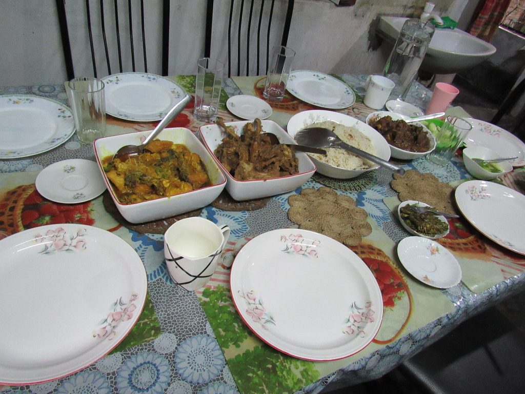 A long dinner table set for a large group