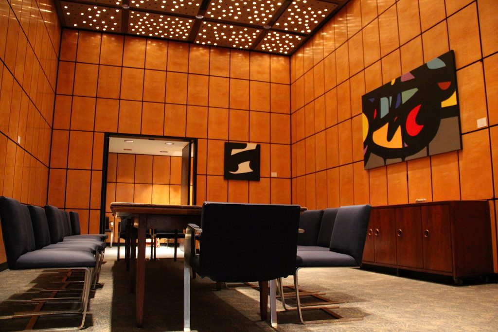 An empty private dining room laid for a group dinner