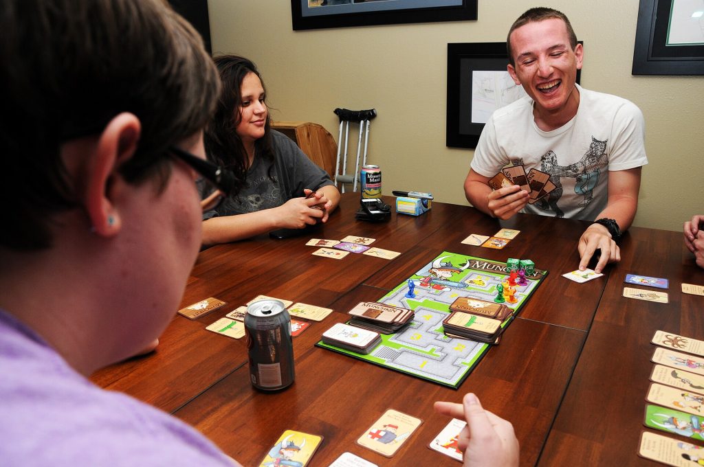 Friends playing cards at a table