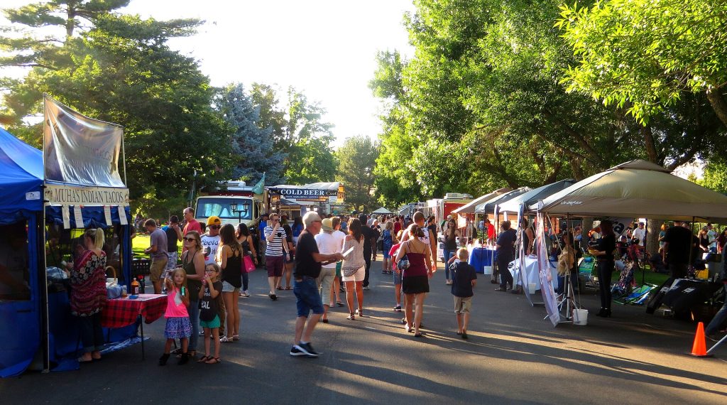 A food truck parked on a paved lot ready for an outdoor event