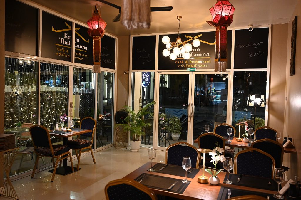 A candlelit dinner table set for a celebration meal