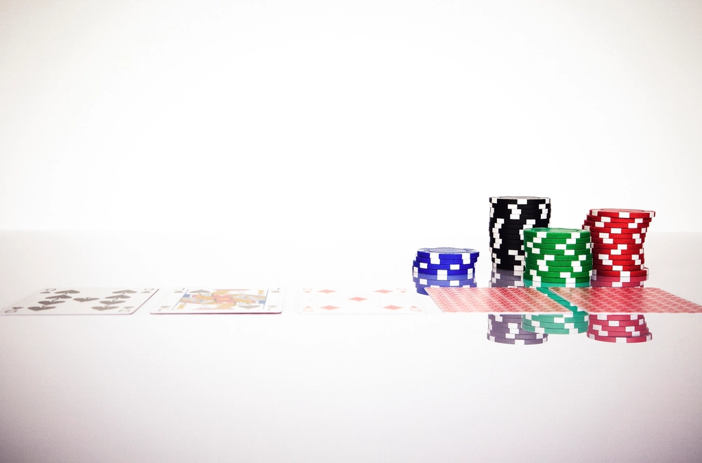 Poker chips and playing cards on a table