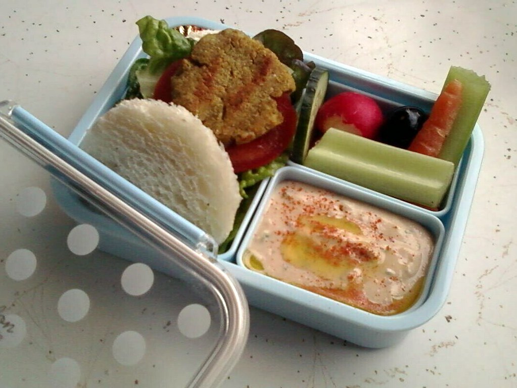 Individual cups of cut vegetables with dip
