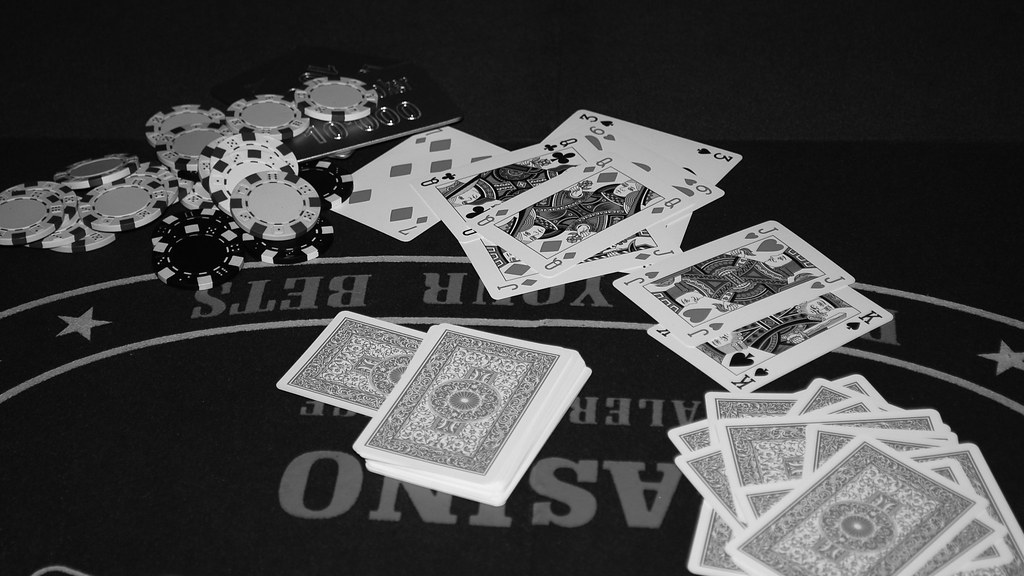 Playing cards and poker chips on a table