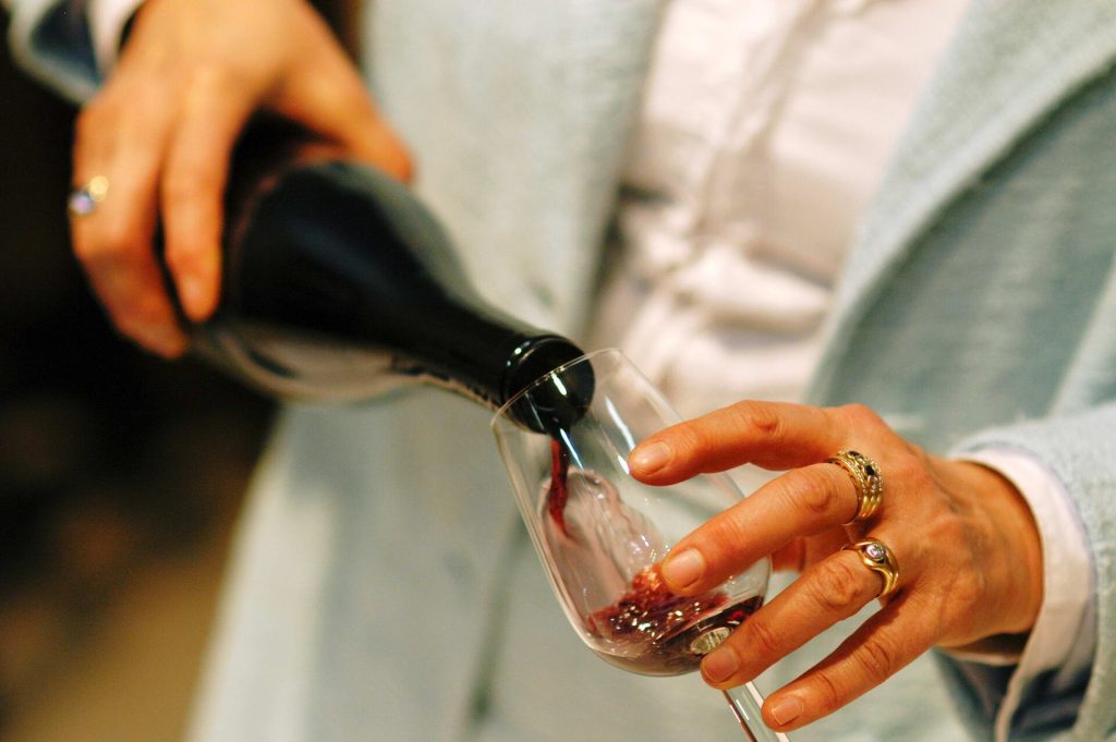 A glass of red wine on a restaurant table