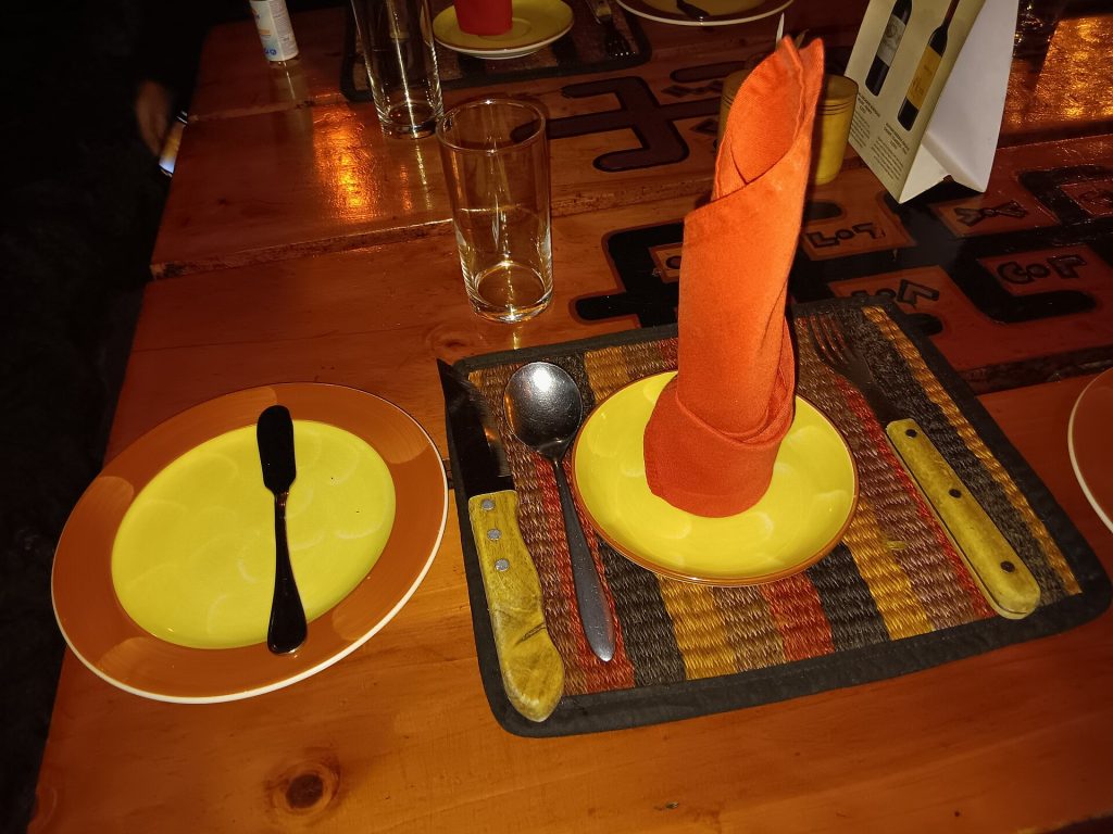 A set restaurant table with glasses and cutlery