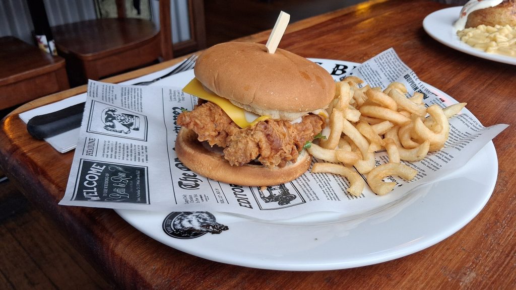 A Southern plate of fried chicken with greens and mac and cheese