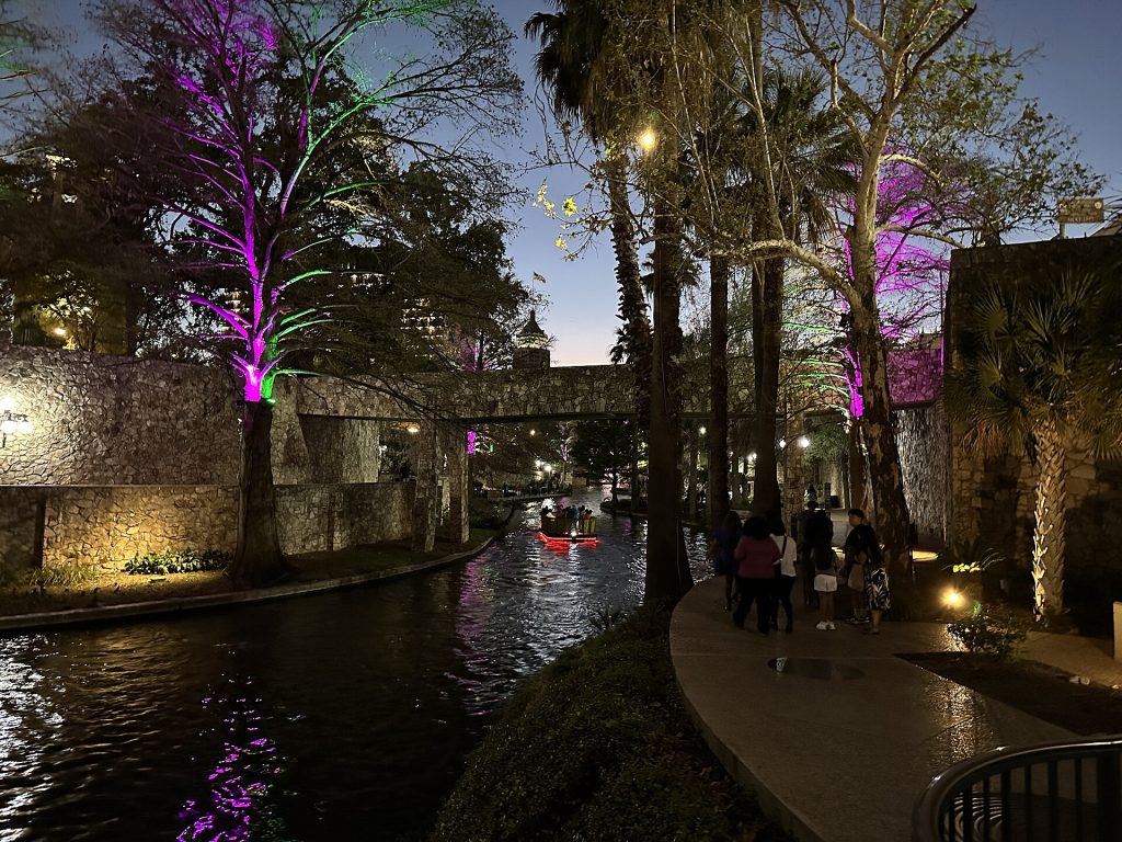 Restaurant tables and umbrellas along the San Antonio River Walk