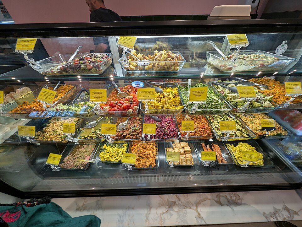 Fresh salad bar counter in a food service setting